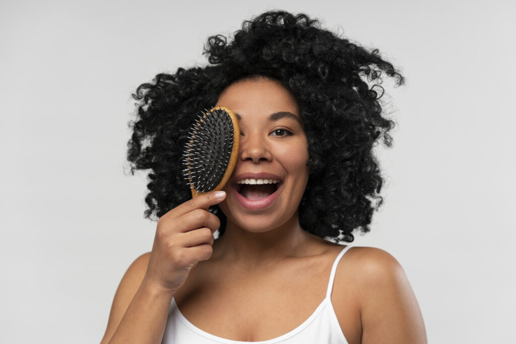 portrait young beautiful woman with hairbrush 1