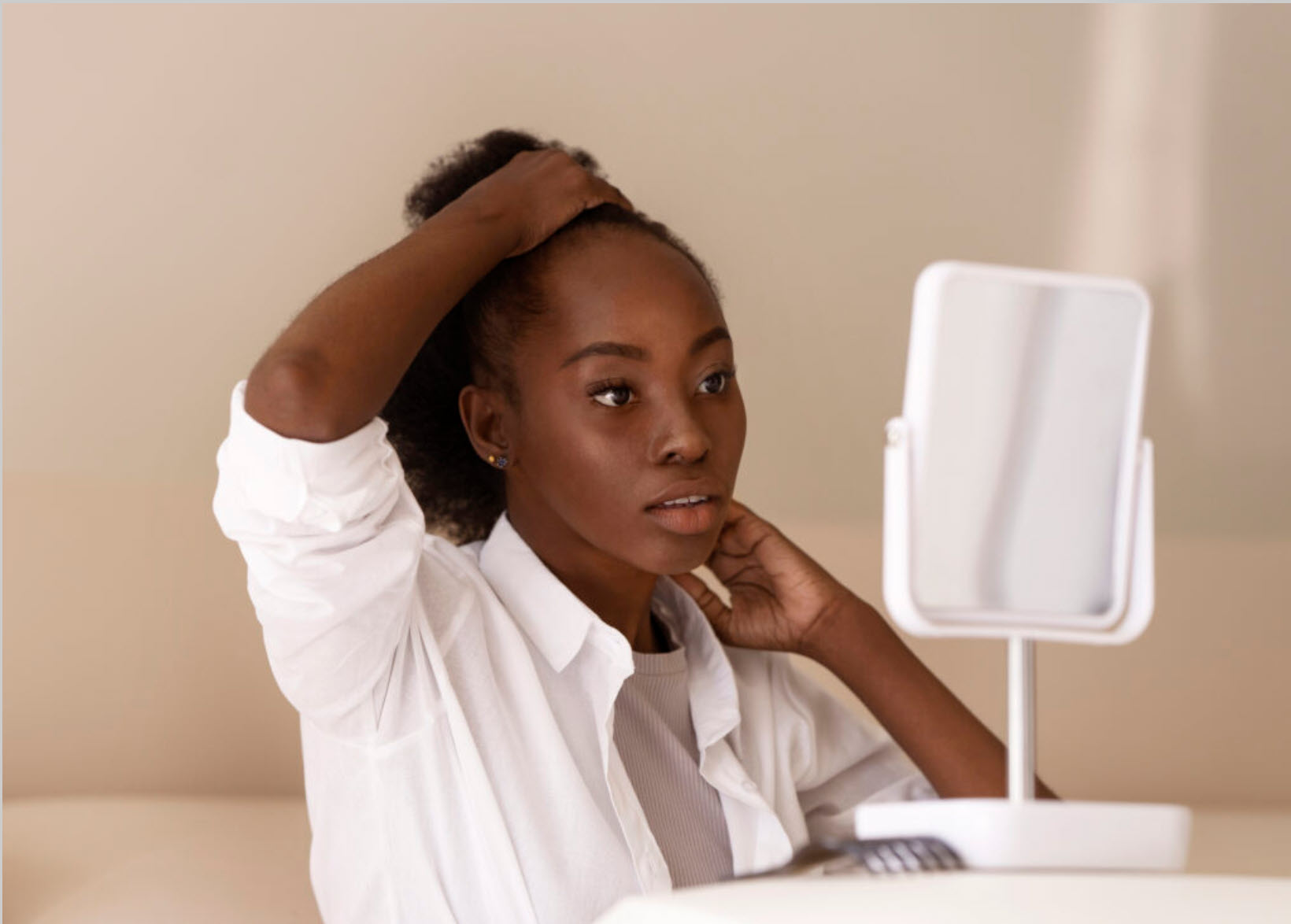 side view woman styling hair