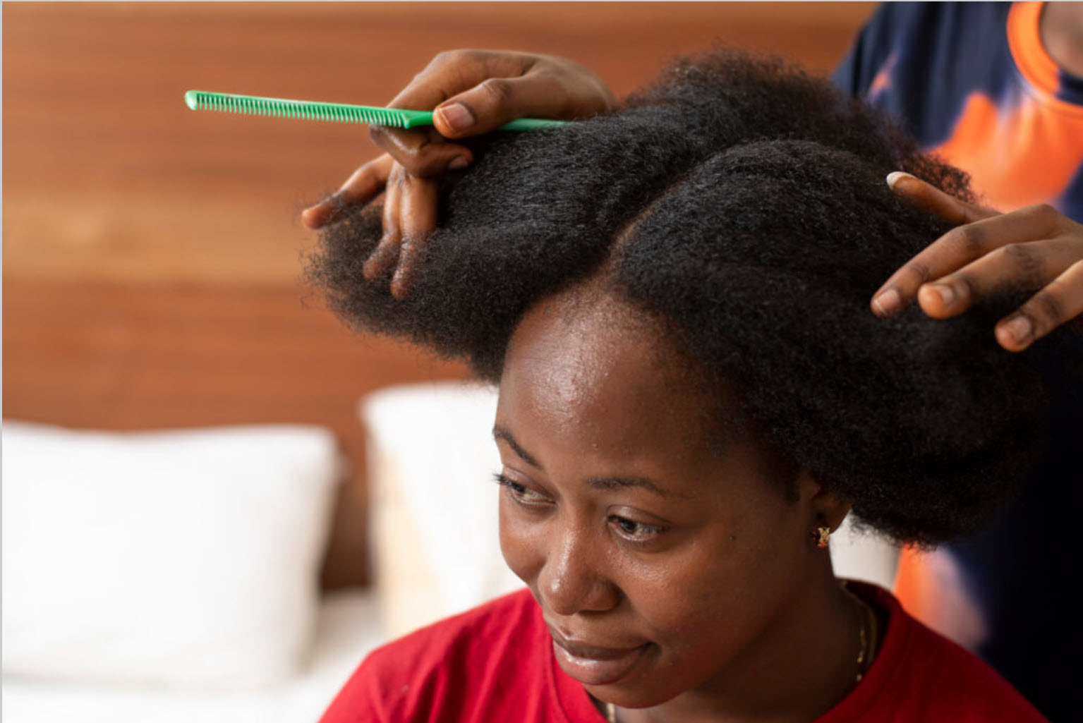 stylist woman taking care her client afro hair 1