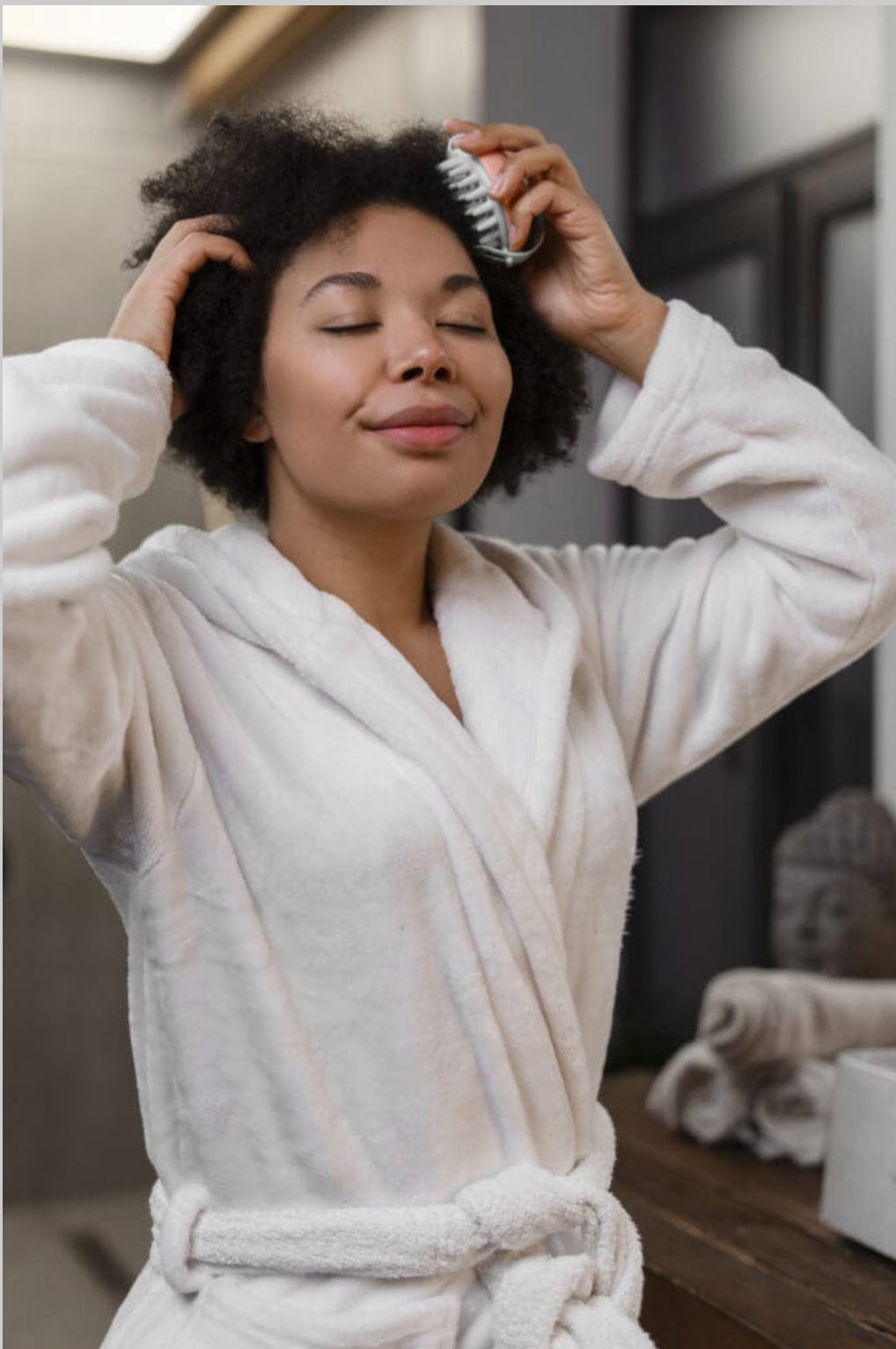 woman giving herself scalp massage 1