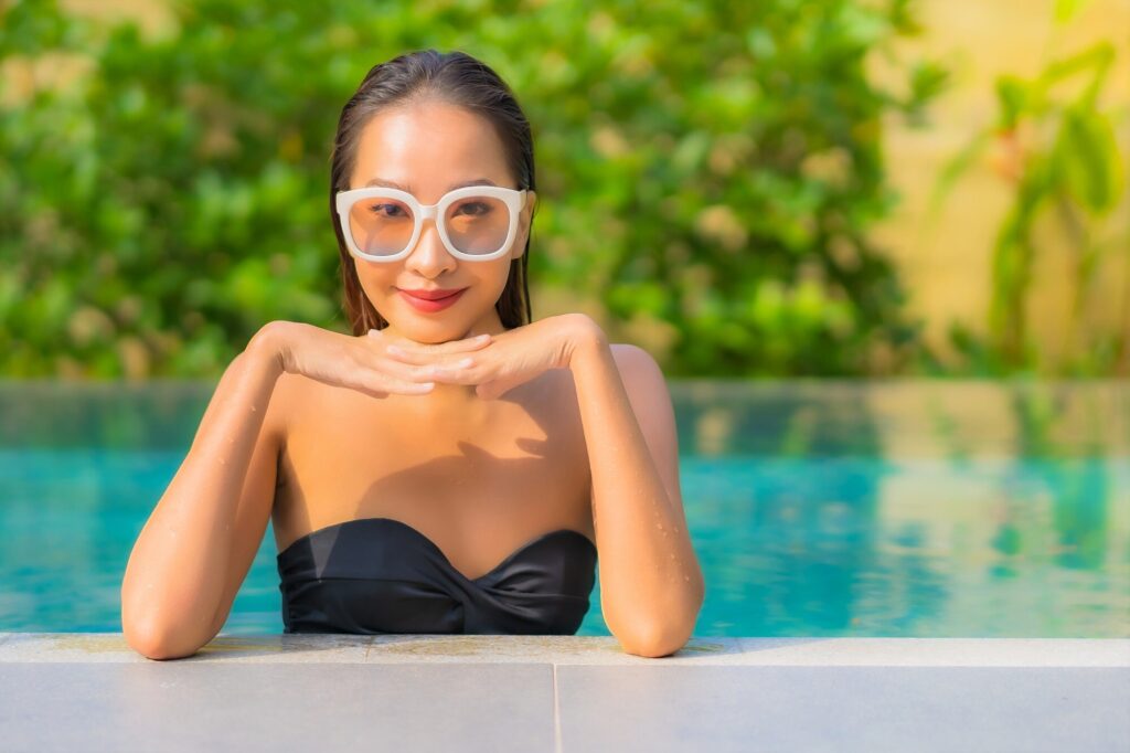 beautiful asian by the pool