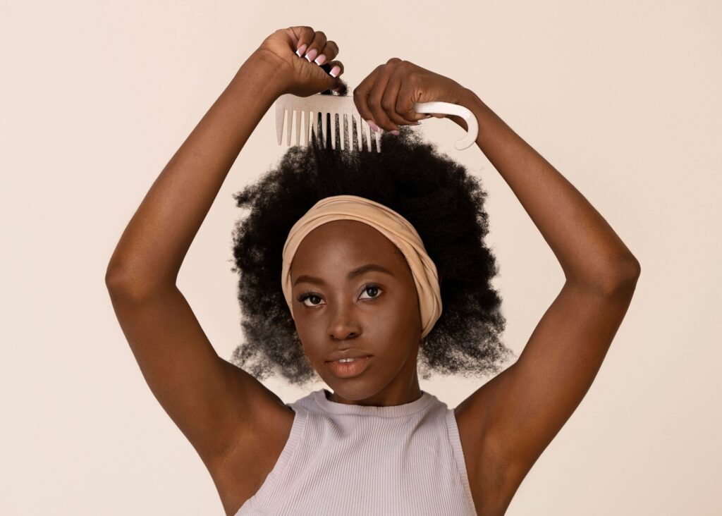 front view woman using hair comb